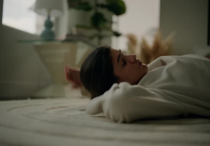 A woman is laying on the floor