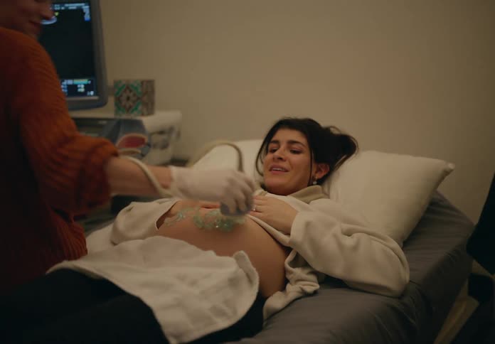 Mother receiving an ultrasound in a clinic