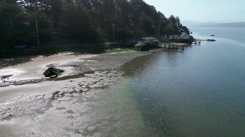 The shore is lined with bungalows