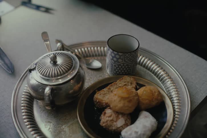 Plate with slices of bread a cup and a container of sugar on the table