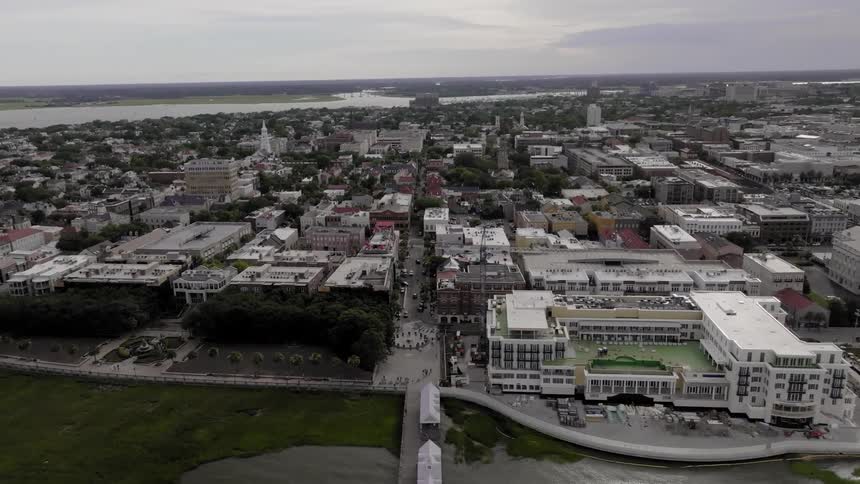 Aerial view of a large city with mostly white towers and buildings