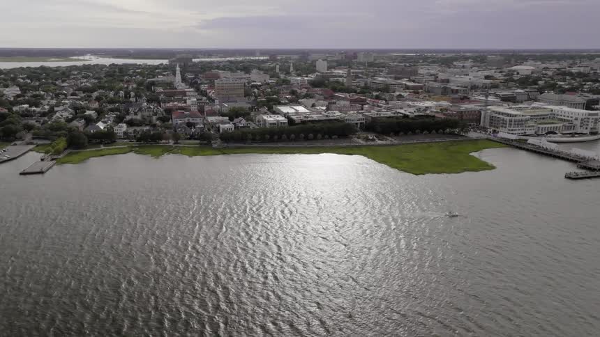 Aerial panorama of a metropolis surrounded by the sea