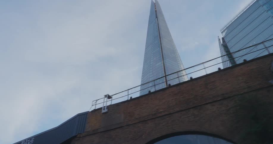 View upwards of a viaduct and a modern skyscraper