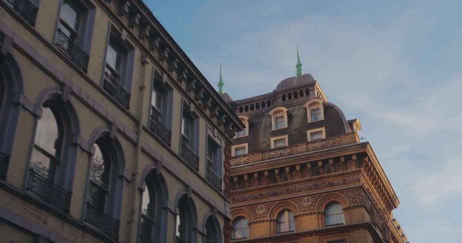 Tall apartment buildings are in the city