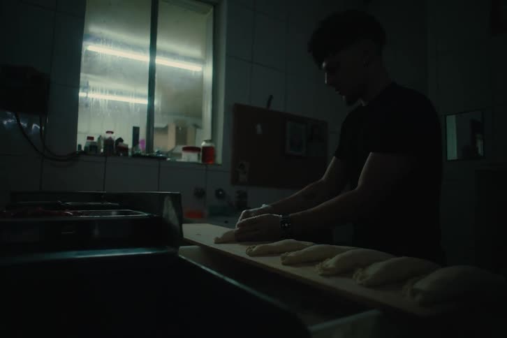Man in a restaurant preparing a puff pastry dough