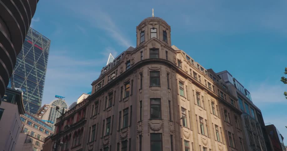 Old building with ornate details against modern skyscrapers