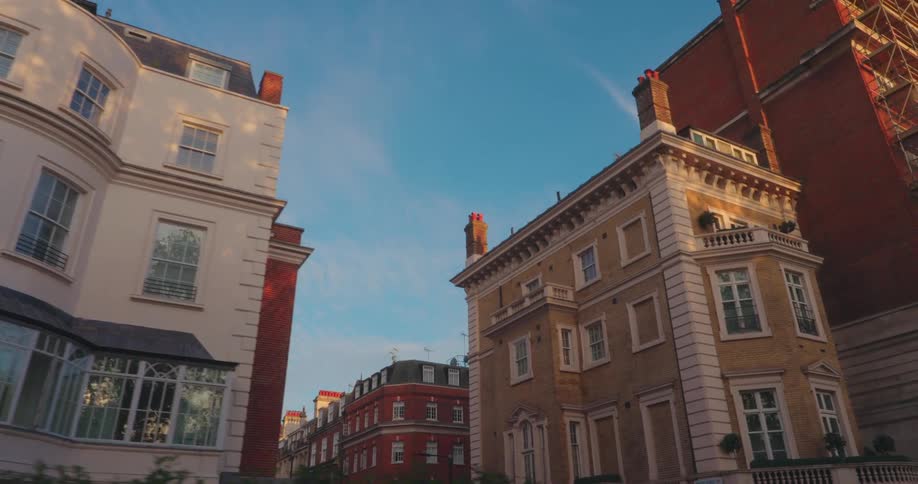 Urban buildings in a city with sun reflection