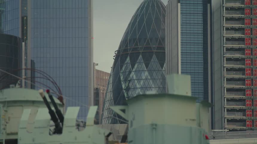 Cone topped skyscraper forms a group with four other skyscrapers in city downtown