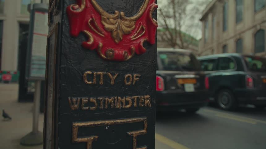 Close up of a decorative cast iron lamp post in the city of westminster
