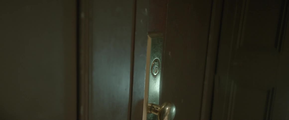A close up of a hotel room door closing