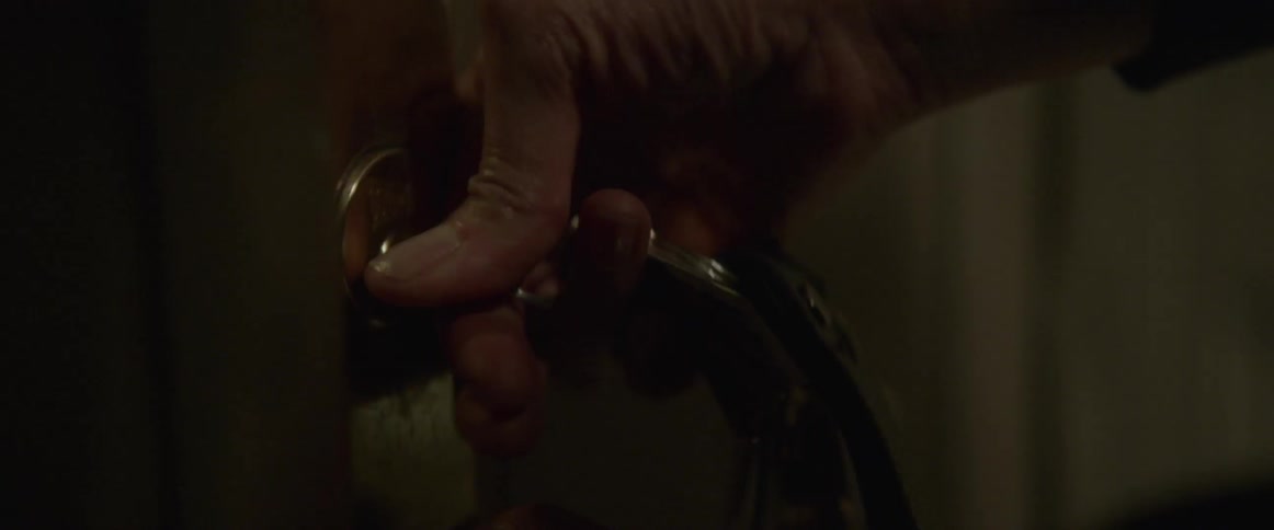 Person turning a key and opening a door