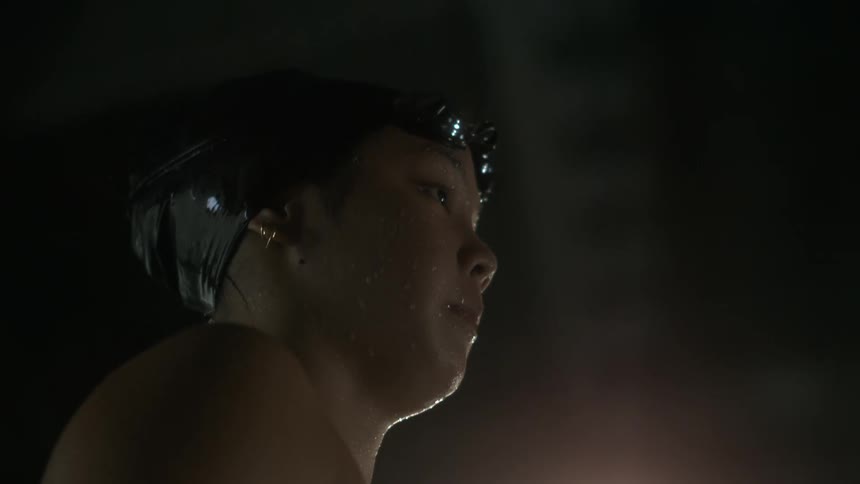 Water is dripping from the swimmer
