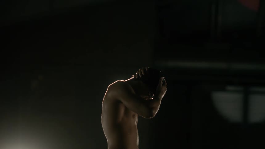 A swimmer wearing goggles and a cap prepares to swim