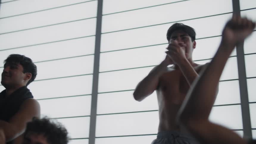 Young teenagers cheering and clapping