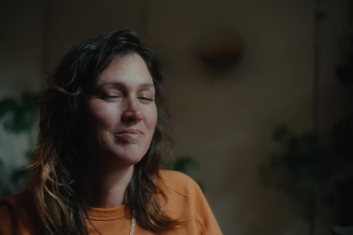 A woman is smiling