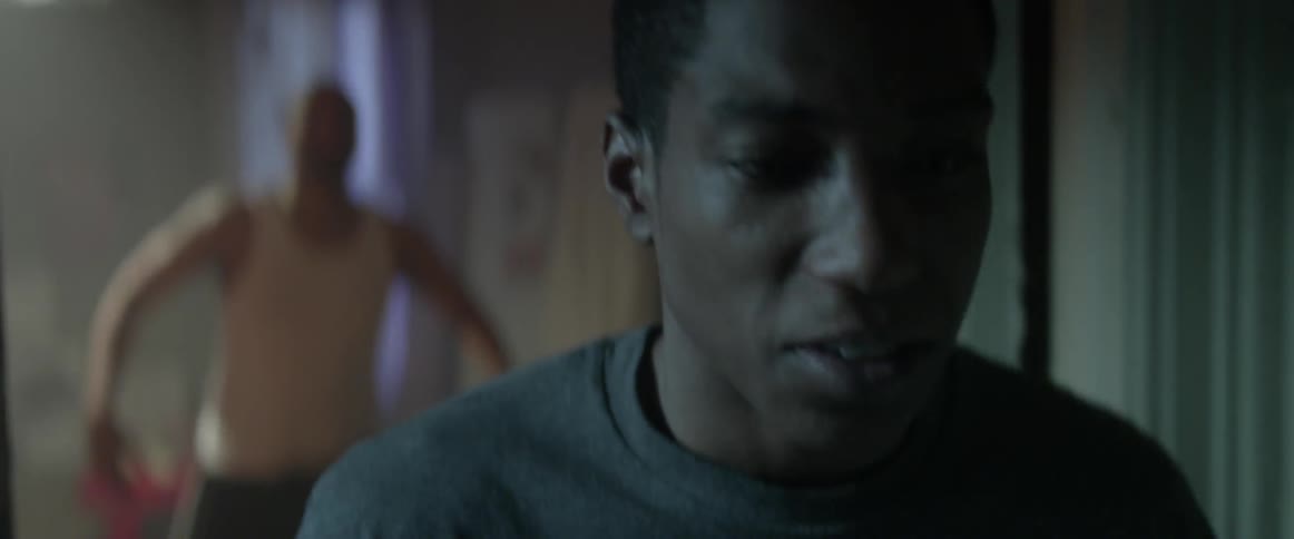 A teenage boy walks away from his angry father