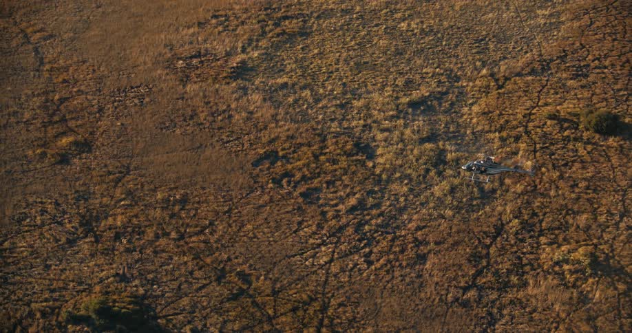 Aerial panorama of a helicopter flying above the ground