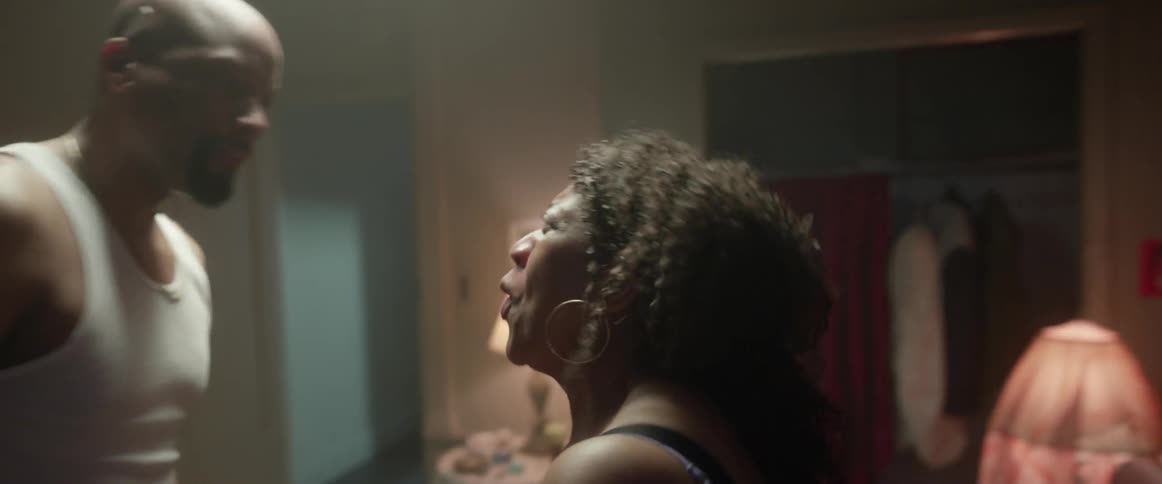 A couple yelling and fighting in a bedroom