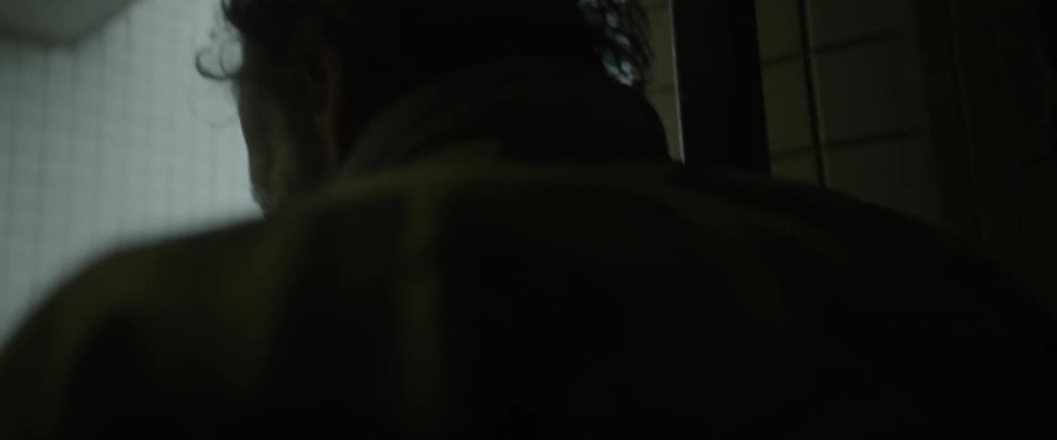 A man walks up a flight of stairs