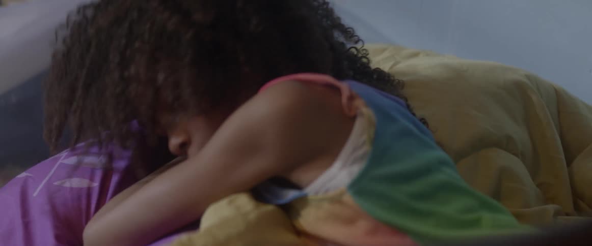 A sleeping girl is unhappy to be woken up