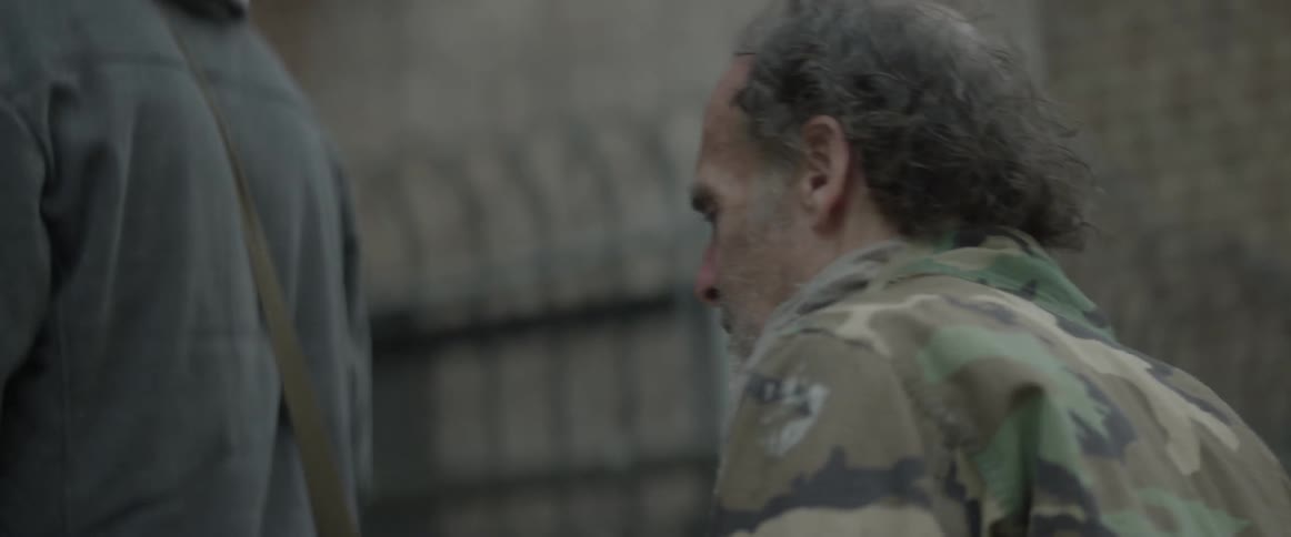 A man walks on a city street