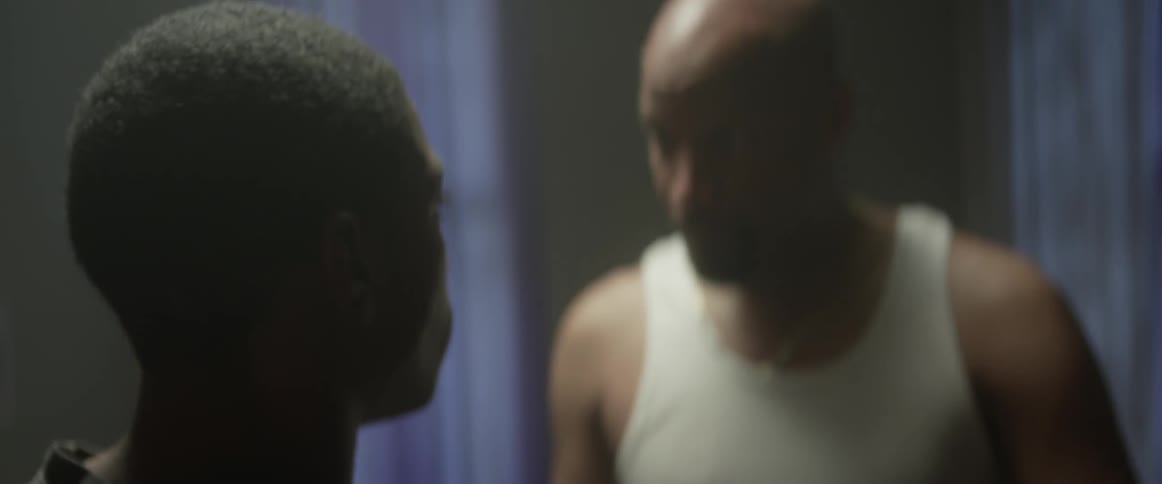 A man is arguing with someone in a home