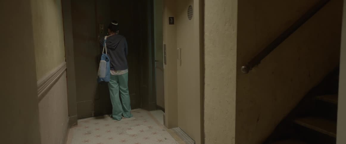 Woman opens the door to her apartment