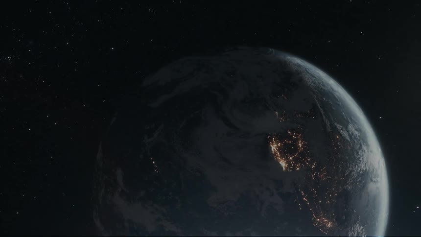 A partially illuminated earth with visible continents and swirling clouds hangs in the vastness of space surrounded by twinkling stars