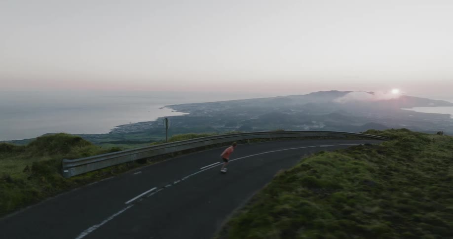 Skateboarding down a mountain road