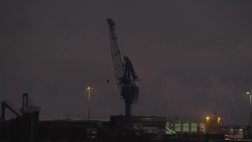 A large metal crane at night