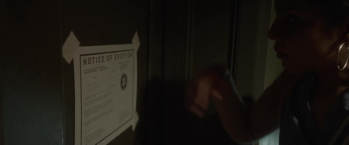A woman discovers an eviction notice taped to her door