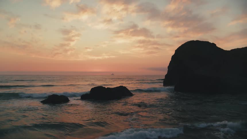 Landscape of a beach with an orange sky
