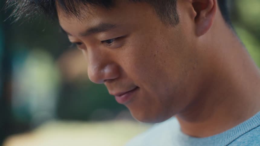 Portrait of a man looking down with a happy facial expression