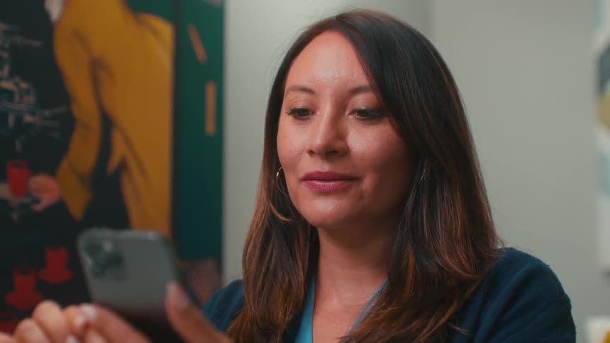 A woman is using her cell phone