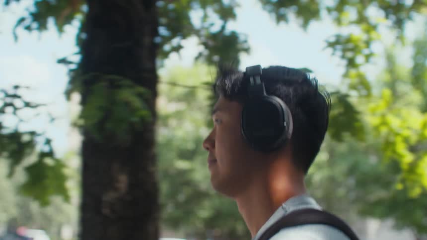 Man walking with wireless headphones