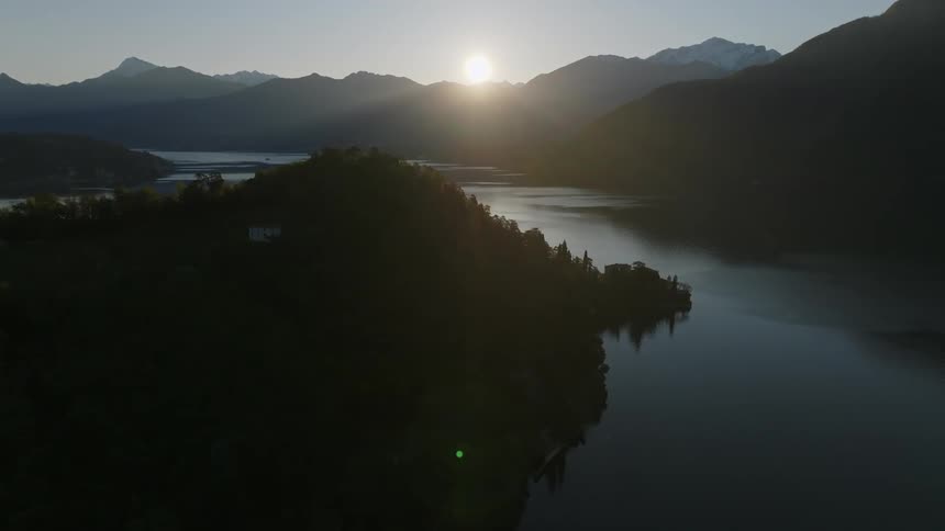 Landscape in the sun on the horizon above mountains and forests