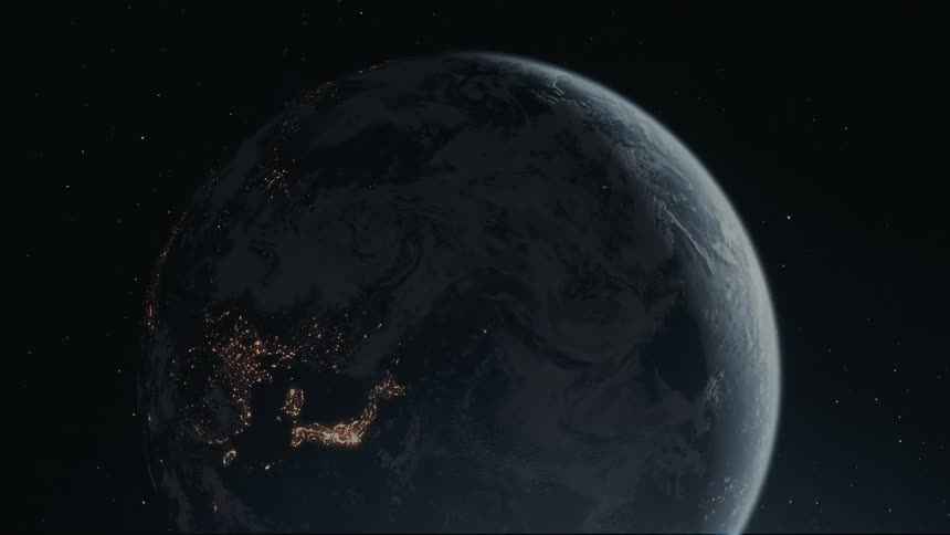 Earth lights shine as the planet rotates through outer space