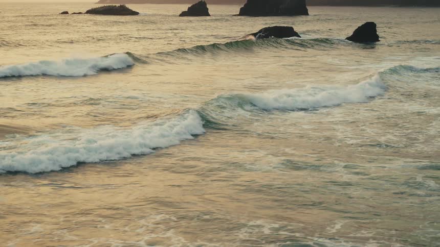 The waves crash on the shore
