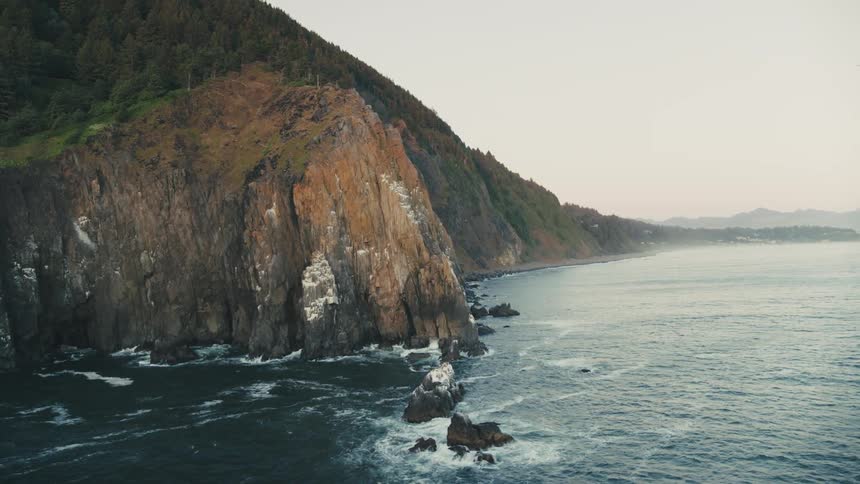 Landscape of the sea crashing with waves on the rocky coast