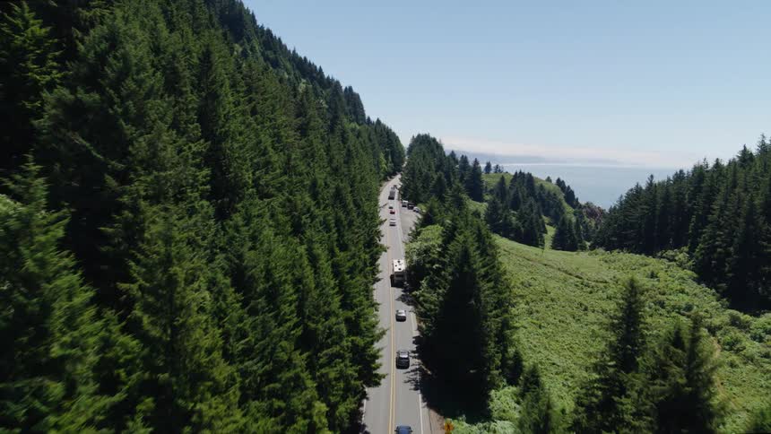 Cars drive on the road on the mountain