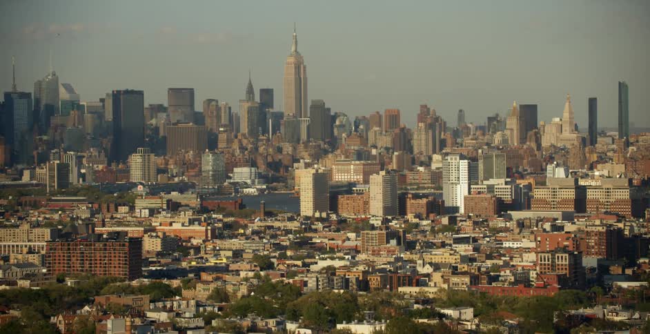 The large city ahead has the empire state building in the middle