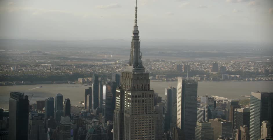 The empire state building towers over the city