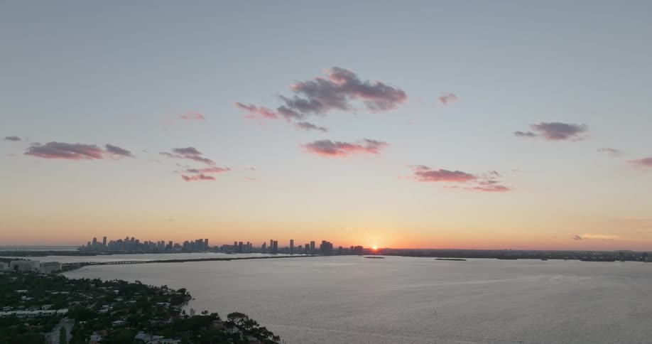 The sun is rising on the city on the horizon