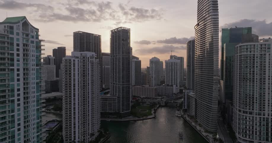 A metropolitan tower block with a river running through it