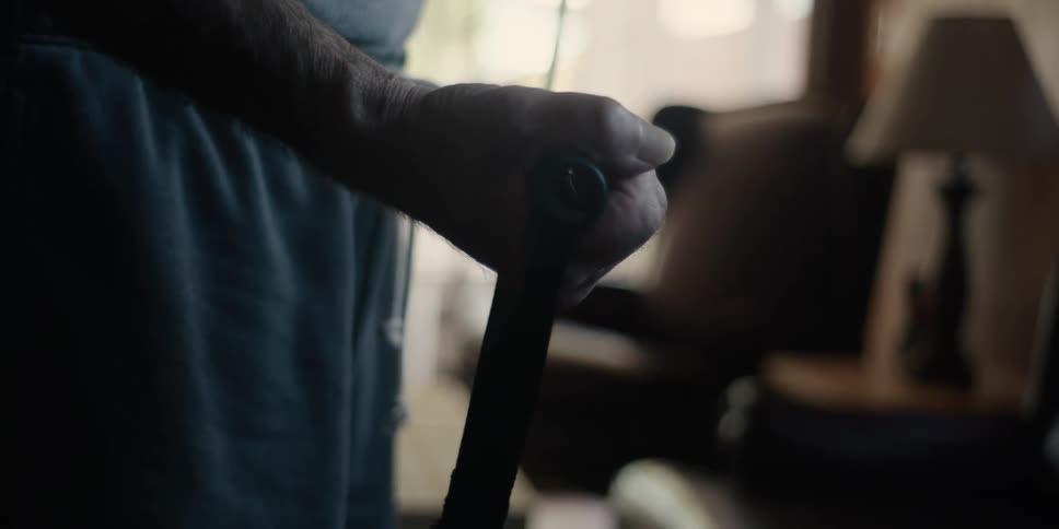 Arms of a man pulling an elastic band alternating hands