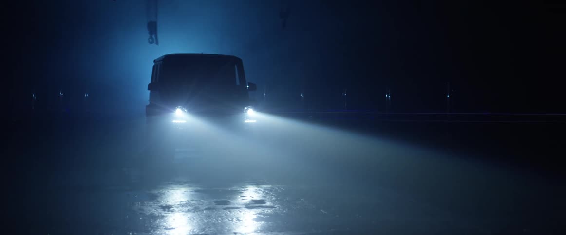 G-Wagon turning on its headlights in a dark environment at night