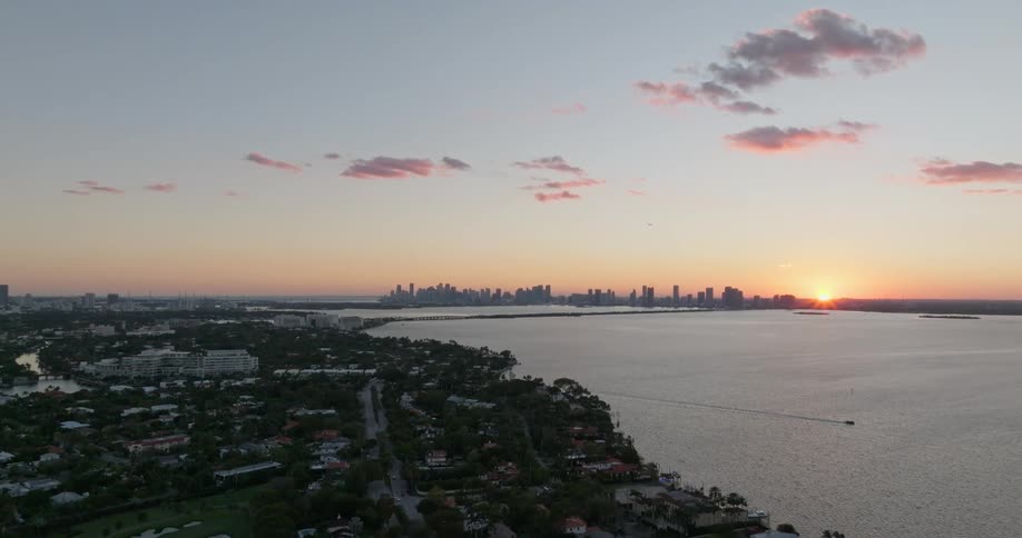 Two cities separated by a large body of water but connected by a bridge