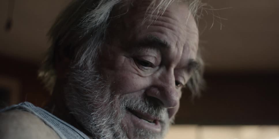 Side portrait of a cheerful elderly man
