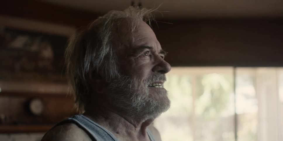Side portrait of a cheerful elderly man