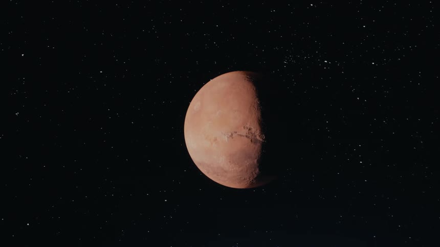 A red planet is spinning in space